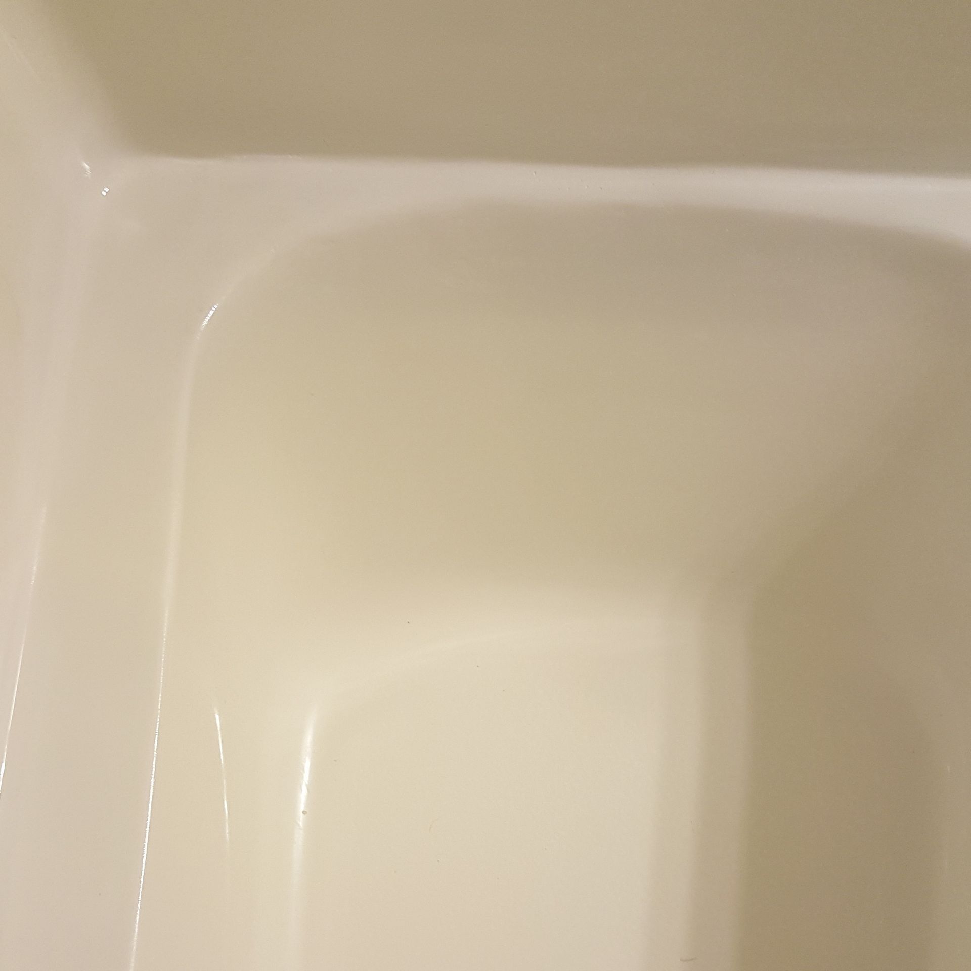 a close up of a repaired white bathtub