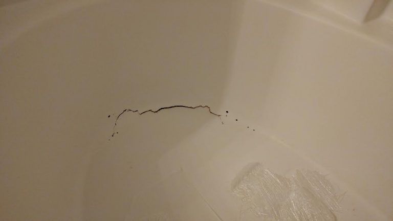 there is a hole in the wall of a bathtub .