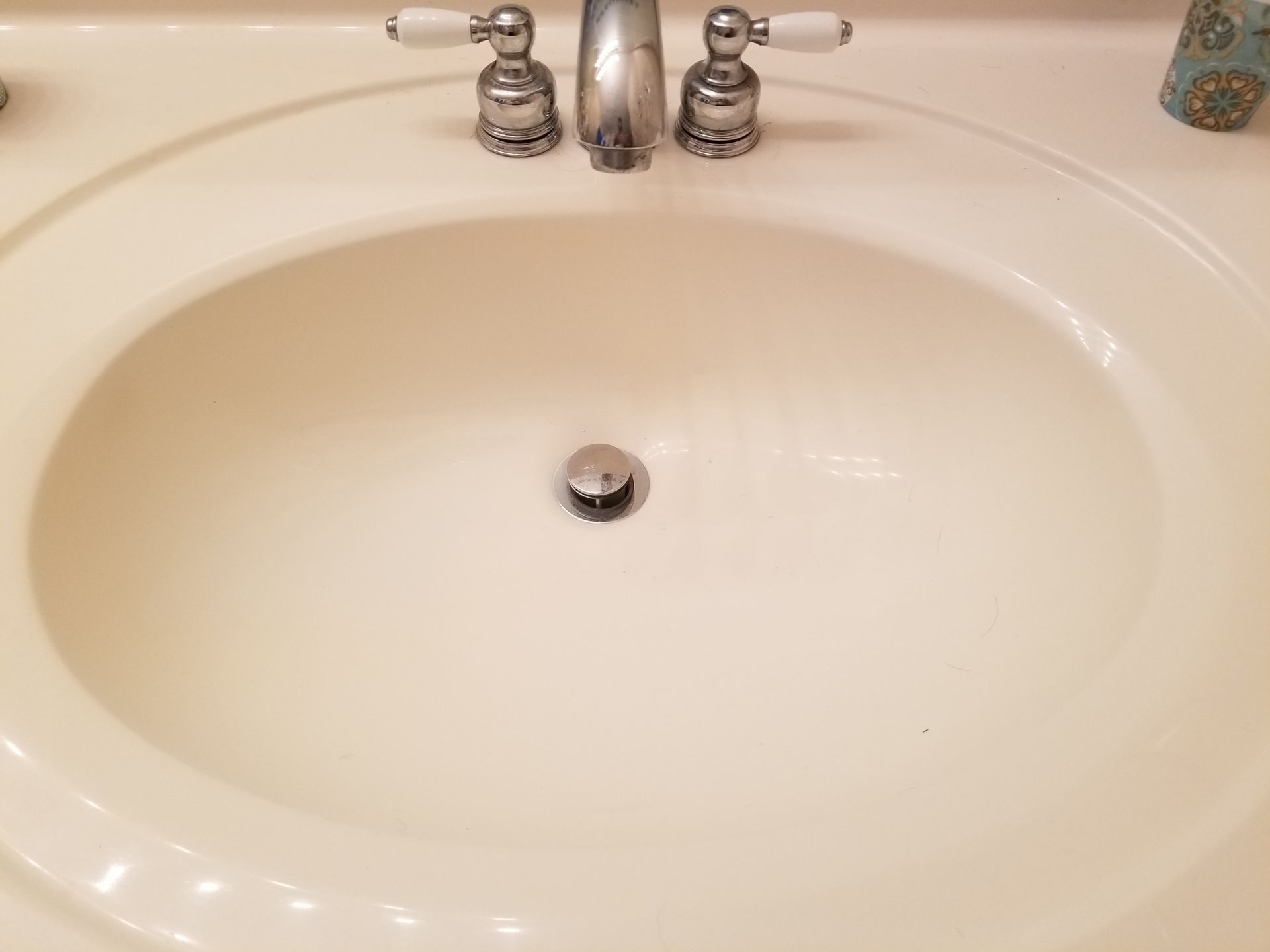 a bathroom sink with a faucet and soap dispenser on the counter .
