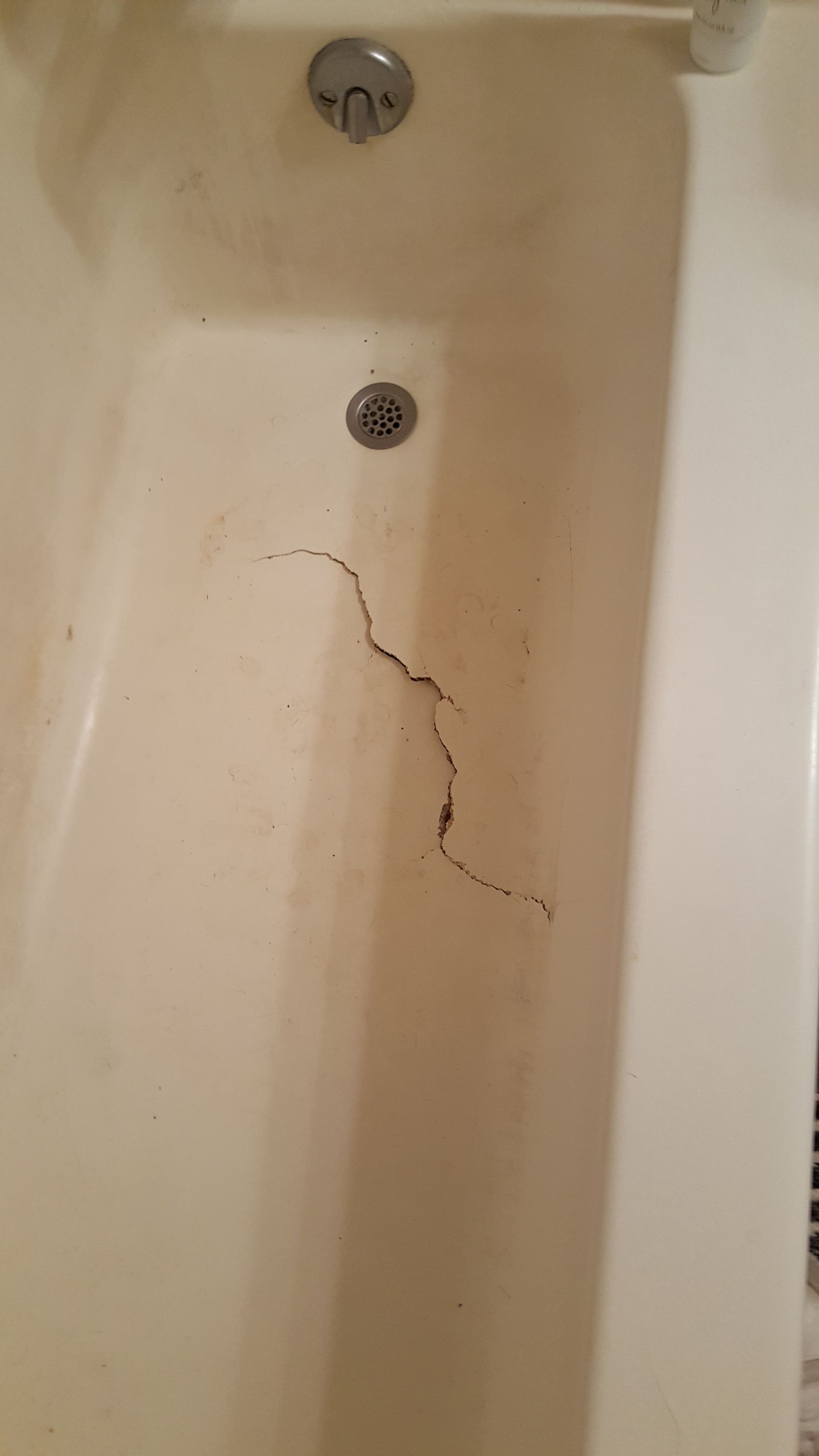 a close up of a bathroom sink with a hole in it,