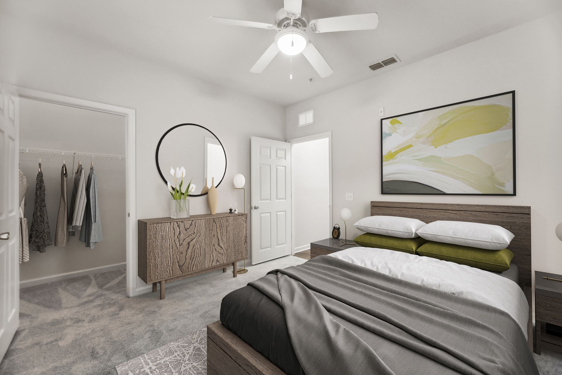 Bedroom with bed, dresser, closet, and ceiling fan. Gray carpet and neutral walls.