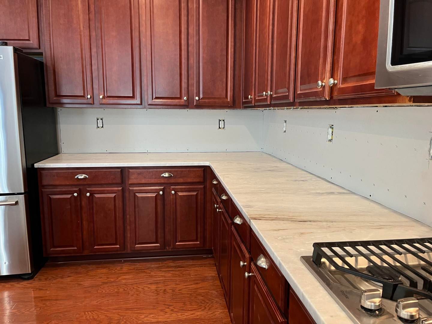 White cabinets with silver handles.