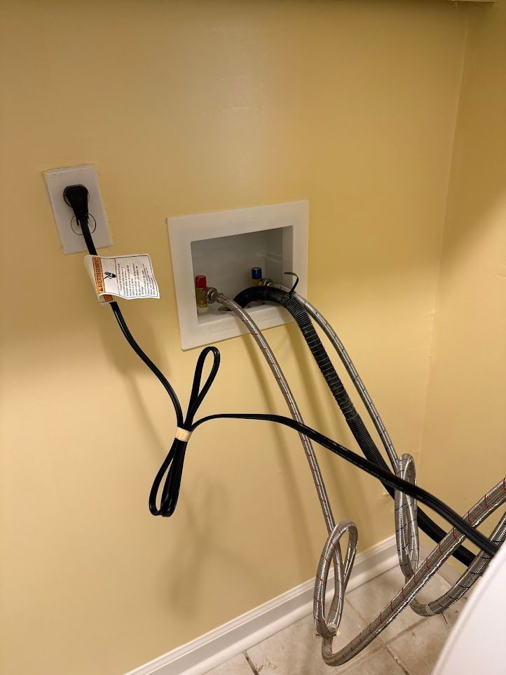 Bathroom with a vanity, mirror, and light fixture; light blue walls.
