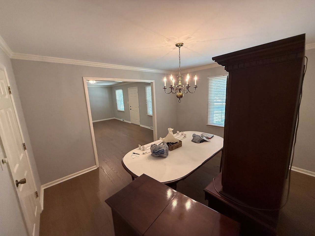 Bathroom with a vanity, mirror, and light fixture; light blue walls.
