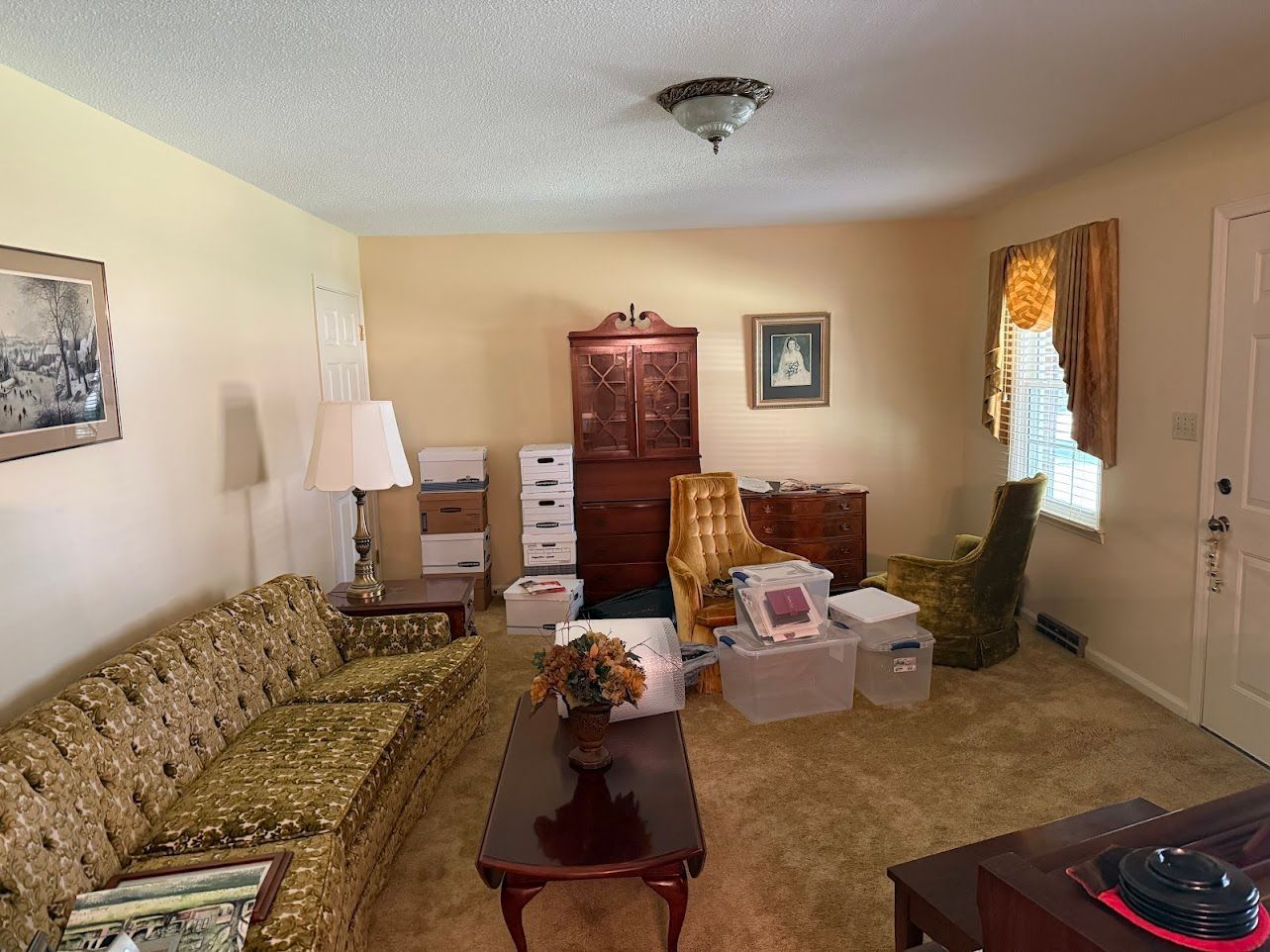 Wooden staircase with white banisters and a baby gate.