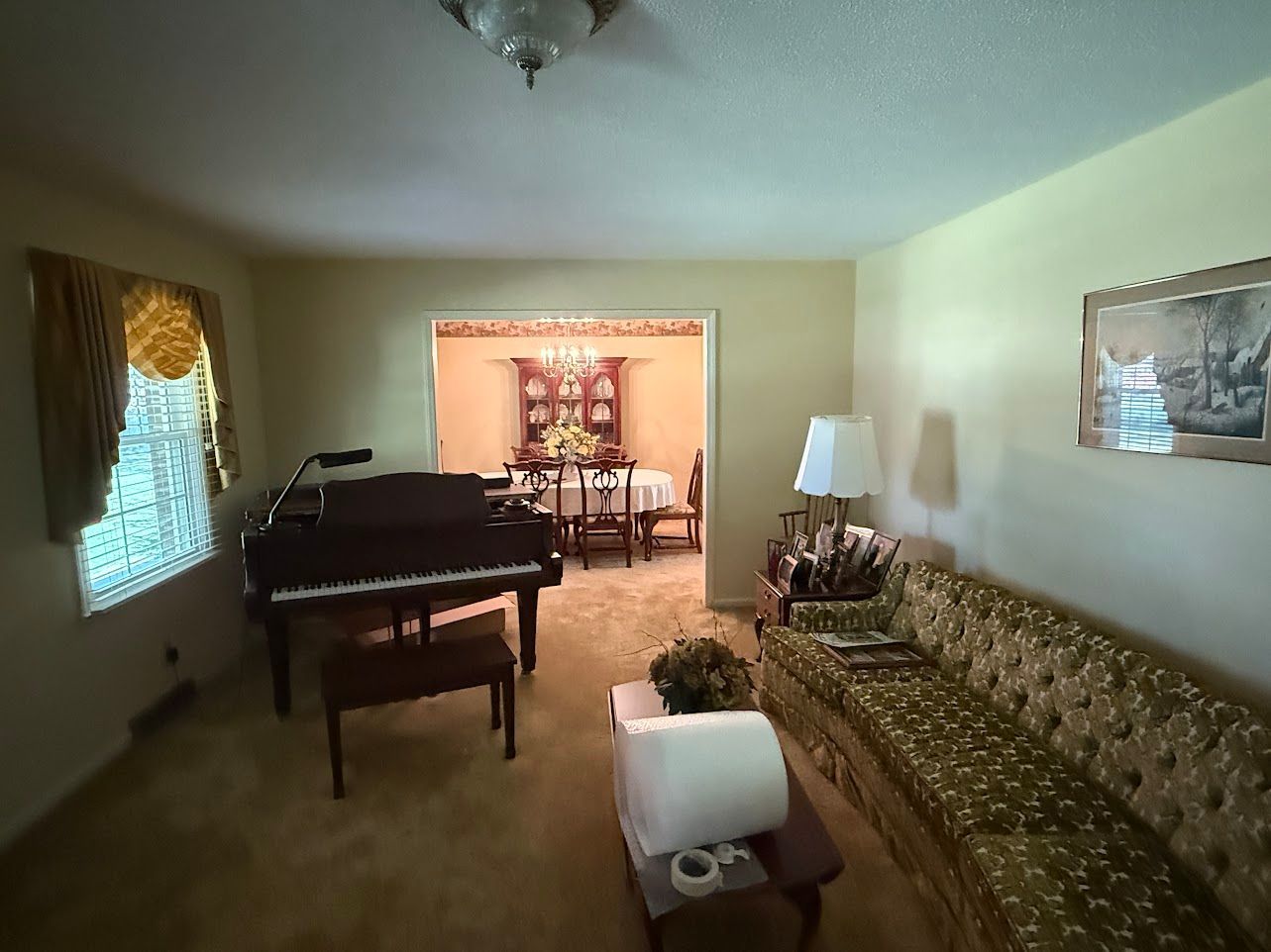 Wooden staircase with white banisters and a baby gate.