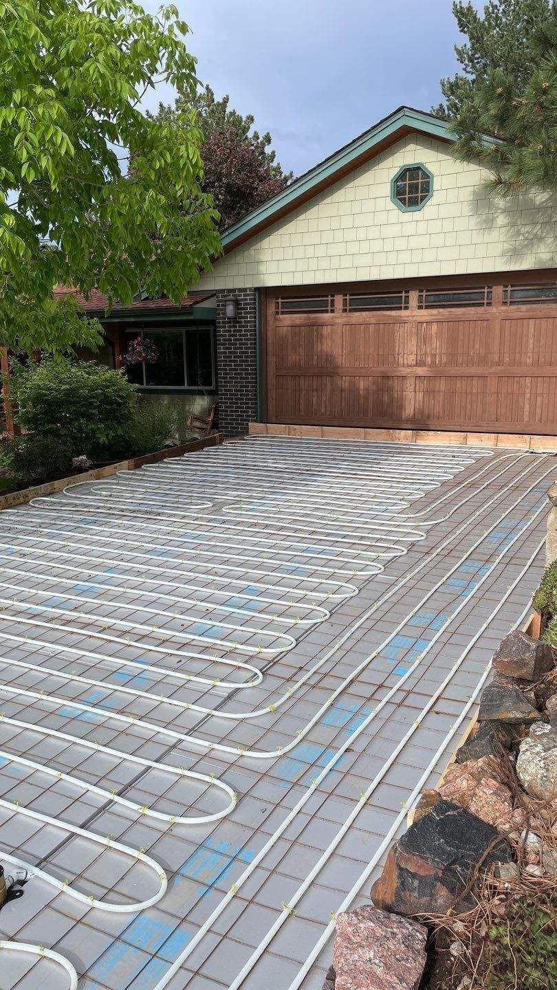 Snowmelt tubing installed in new driveway in existing home