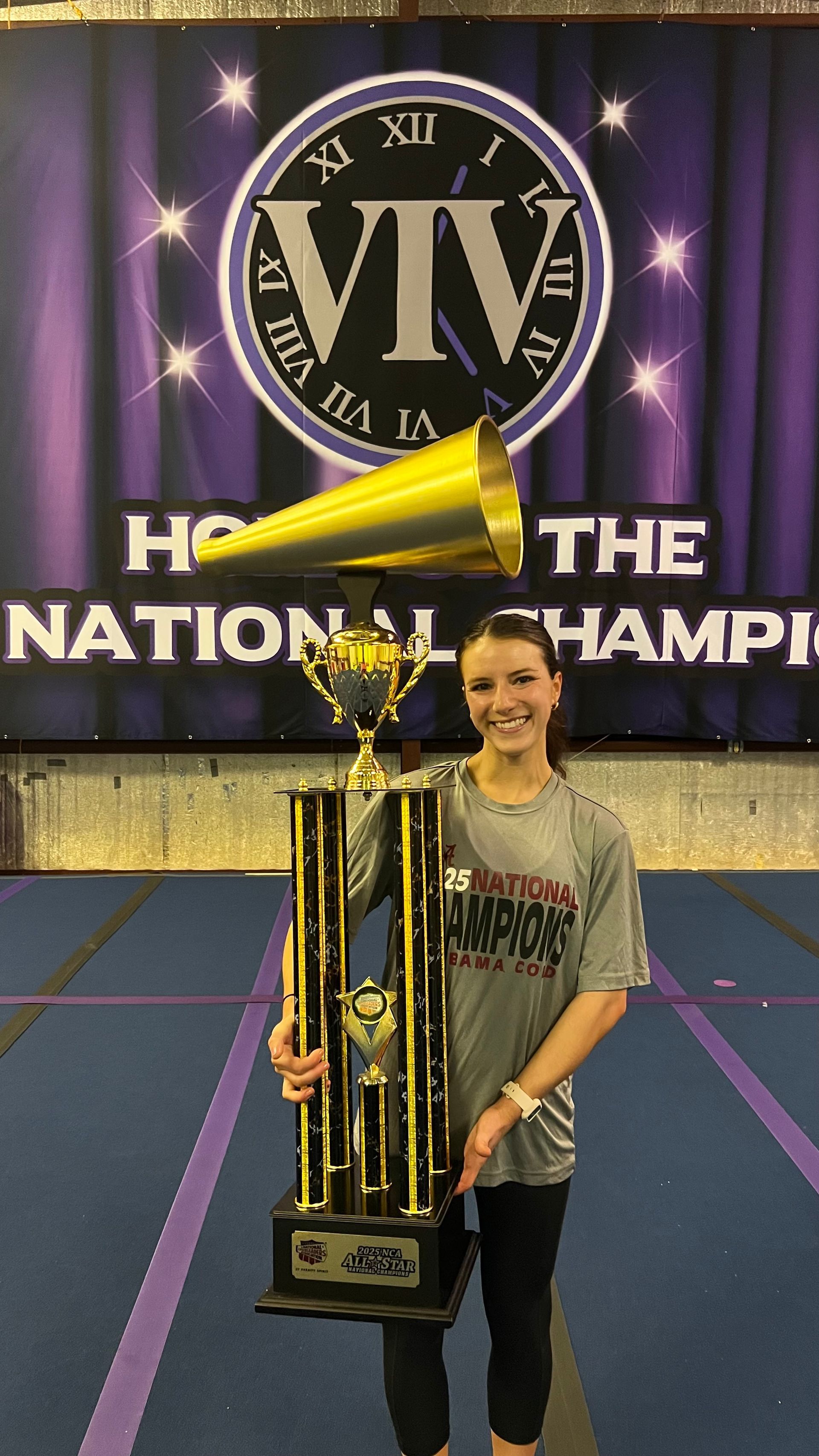 A group of cheerleaders are posing for a picture.