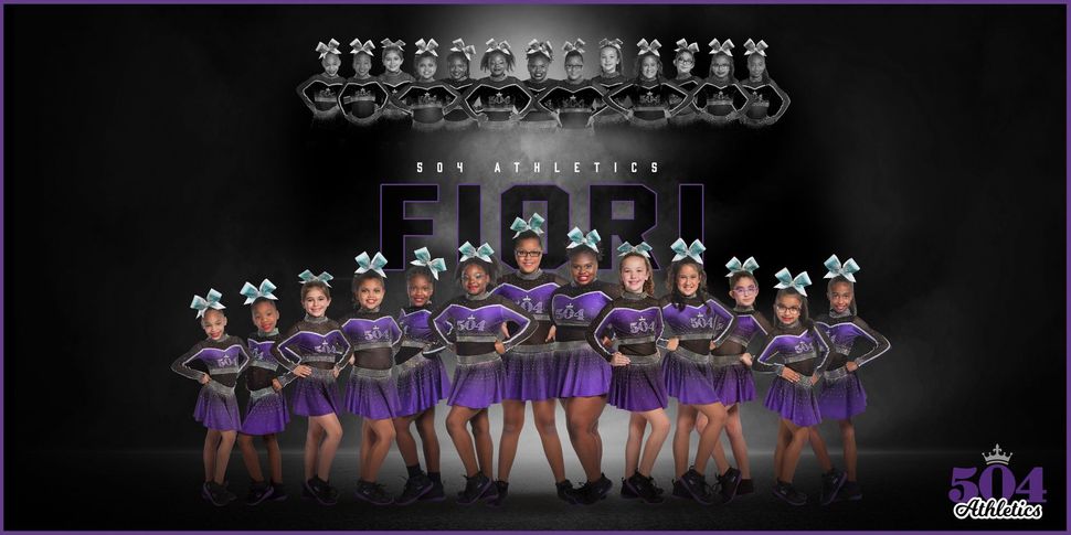 A group of cheerleaders are standing in a row wearing purple dresses and bows.