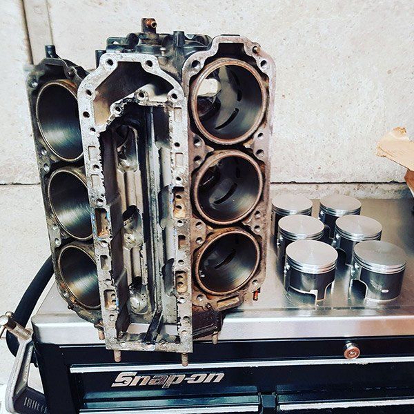 a snap-on toolbox contains a cylinder block and pistons