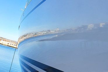 a close up of the side of a boat in the water .