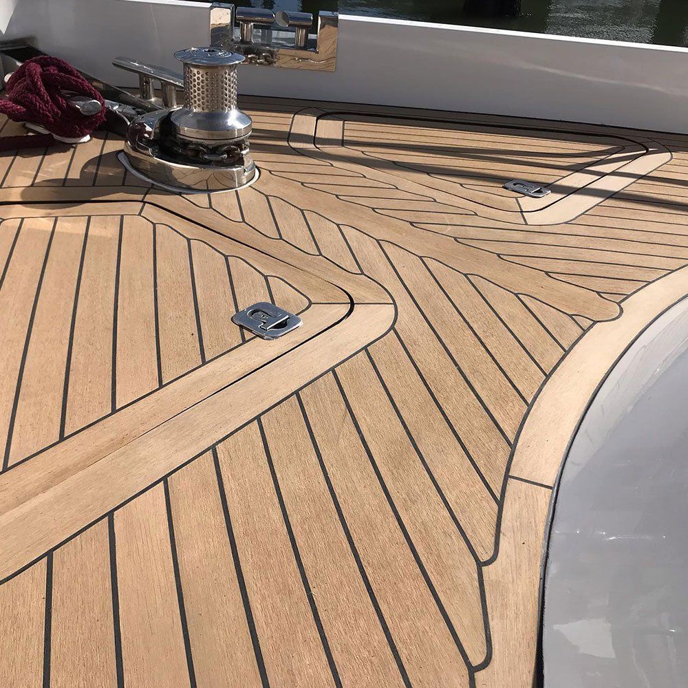 a boat with a wooden deck and a winch on it