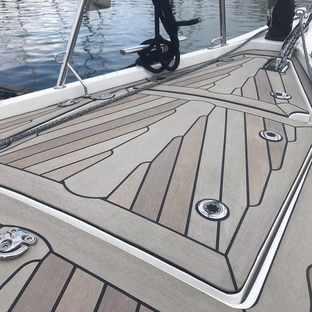 a boat with a wooden deck is in the water