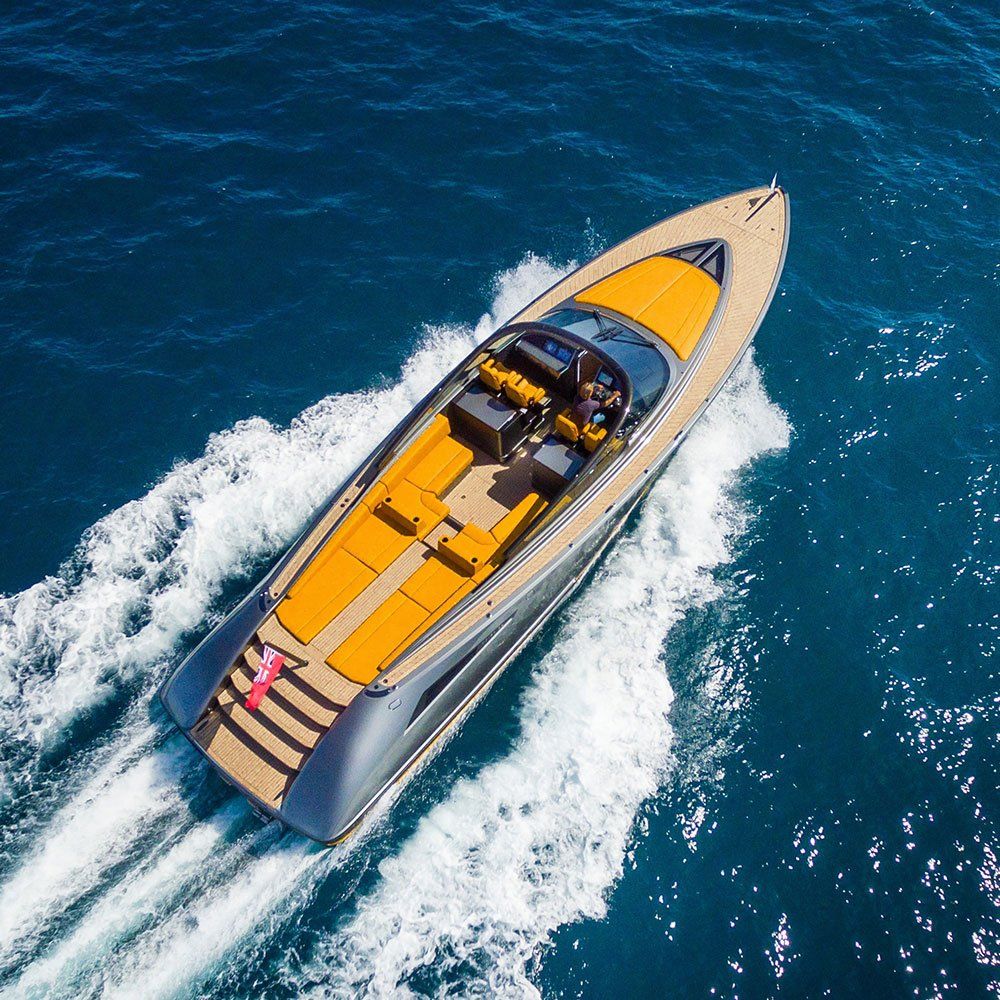 an aerial view of a boat in the ocean