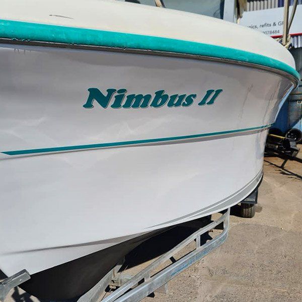 a white boat with the name nimbus ii on it