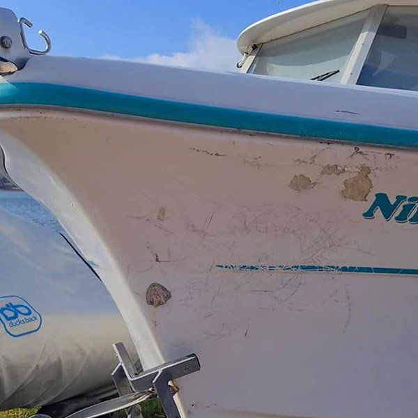 a white boat with the word ni on the side