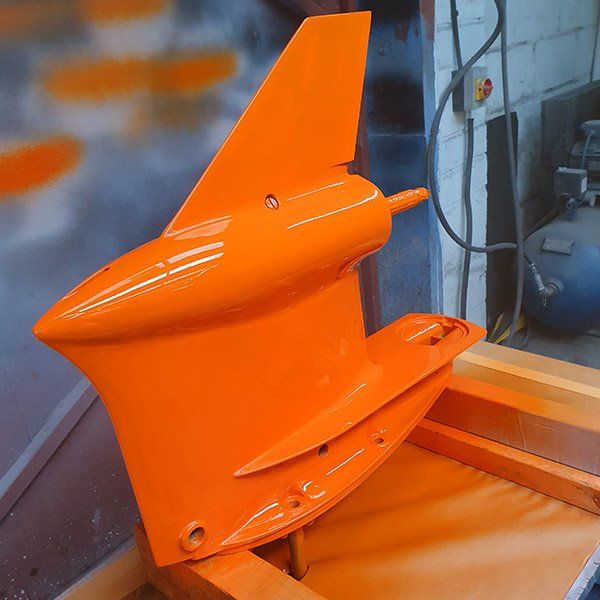 an orange object is sitting on a wooden table