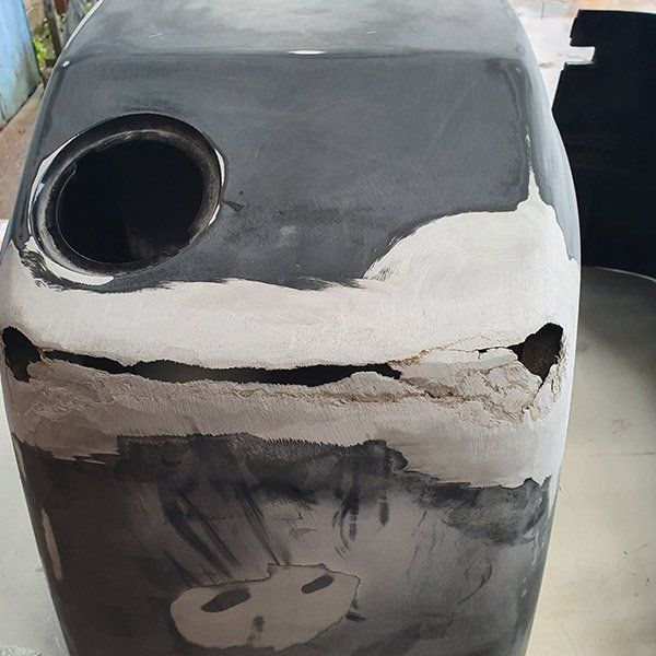 a gray container with a hole in the middle of it