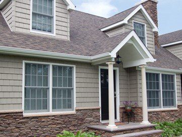 Grey house with nice siding and nice windows — Cheyenne, WY — Frontier Siding Supply