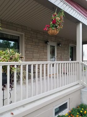 Nice brick house with wooden guard rail — Cheyenne, WY — Frontier Siding Supply