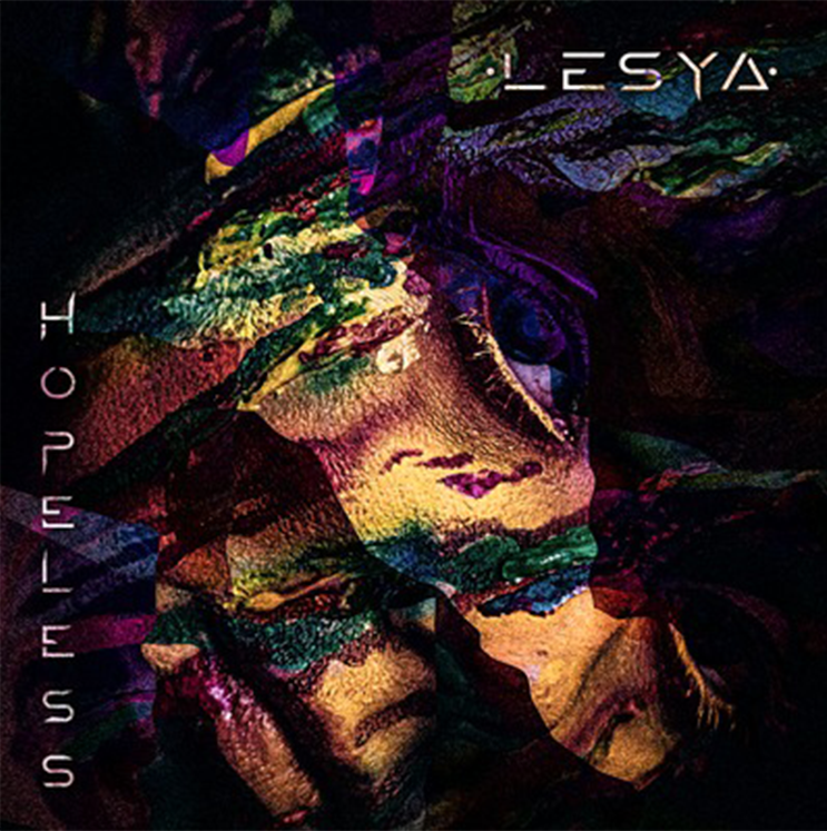 A colorful painting of a woman 's face is on the cover of a lesya album