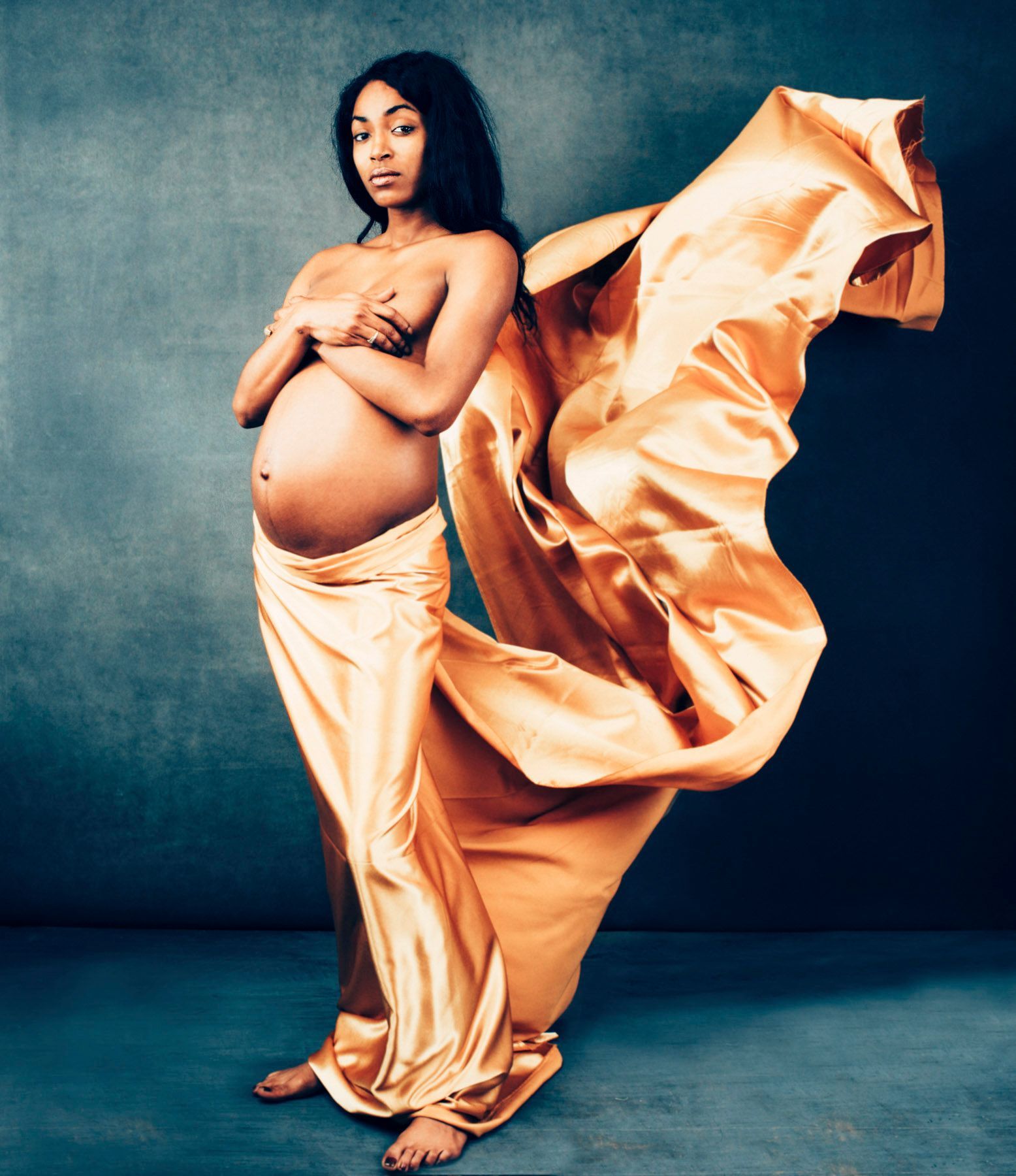  maternity photo portrait of a pregnant Asheville, North Carolina mother in western nc photographer studio, classic implied pose, flowing gown at 30 weeks pregnant