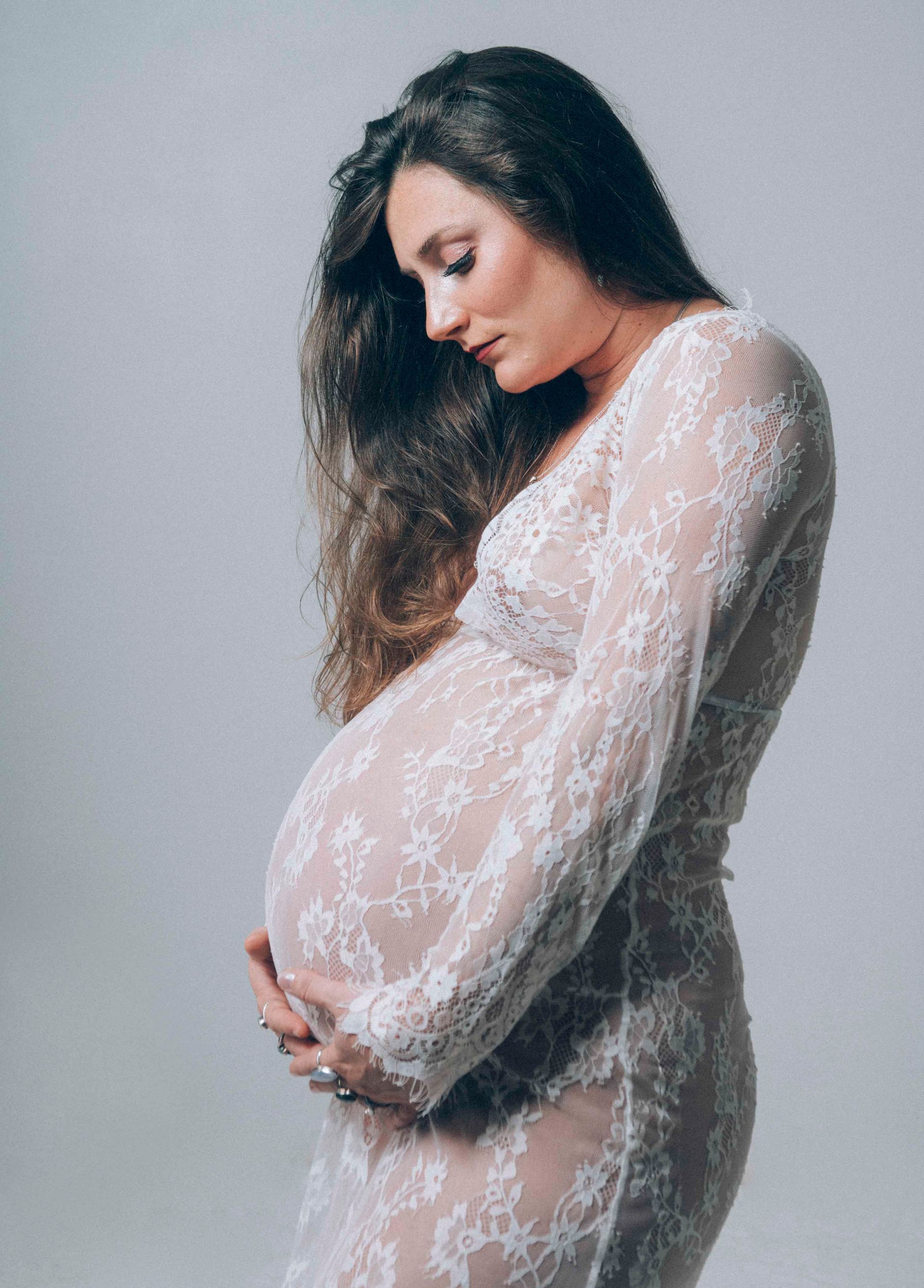 maternity photo portrait of a pregnant Asheville, North Carolina mother in western nc photographer studio, classic implied pose at 33 weeks pregnant