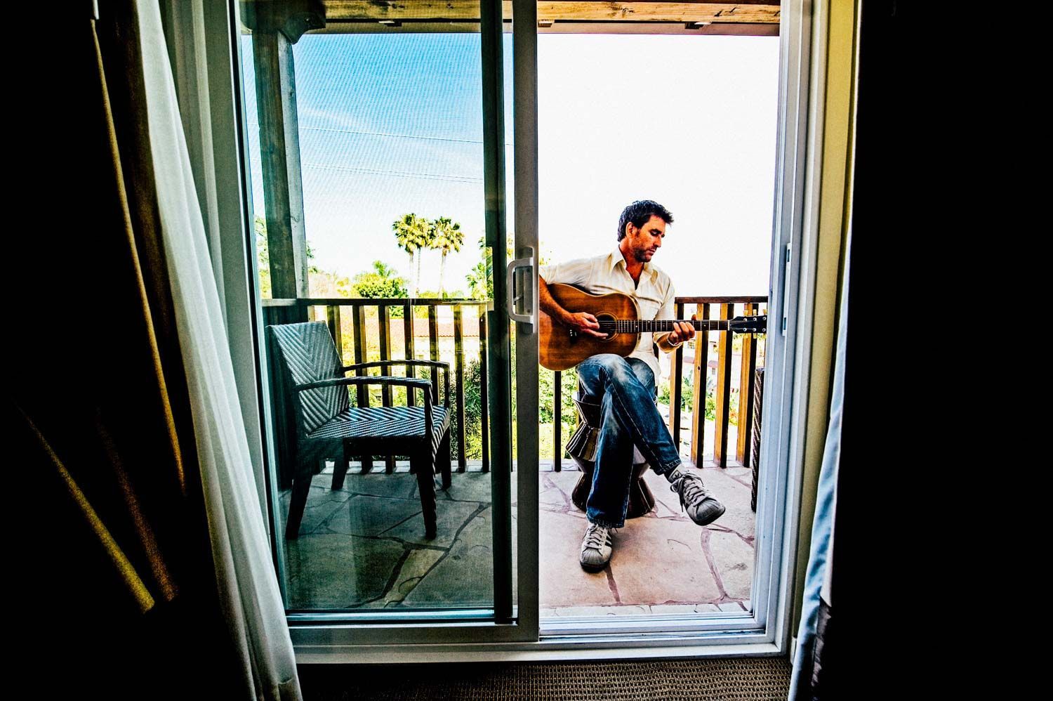 Pete Murray on hotel balcony with guitar, Hollywood, CA