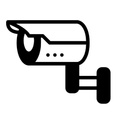 Un icono en blanco y negro de una cámara de seguridad sobre un fondo blanco.