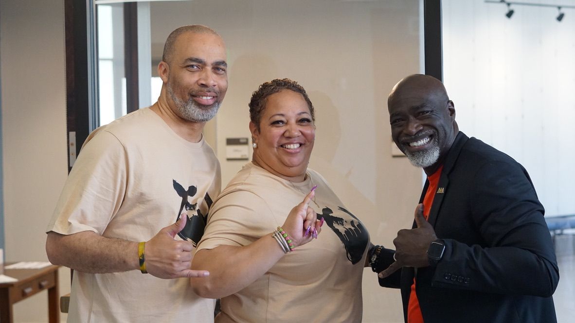 a man and a woman are posing for a picture together .