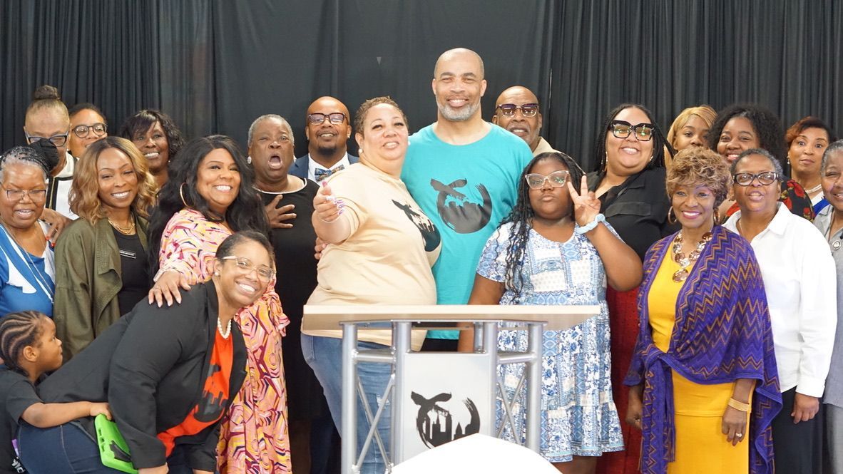 a group of people are posing for a picture in front of a podium .