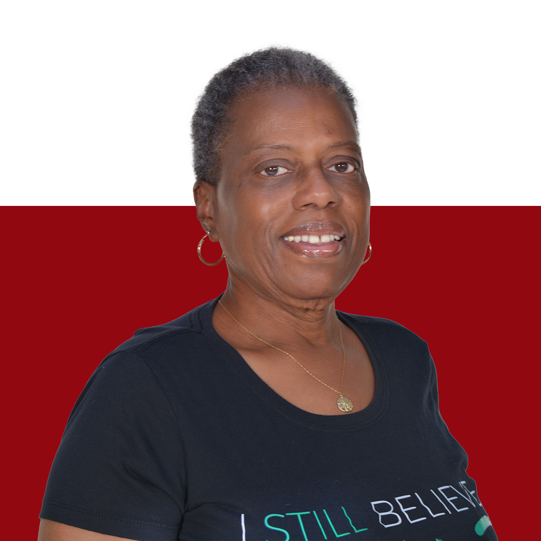 a woman wearing a black shirt that says i still believe