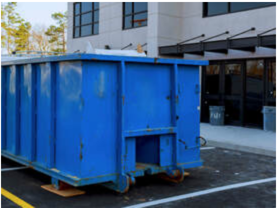 Roll off dumpster at commercial building