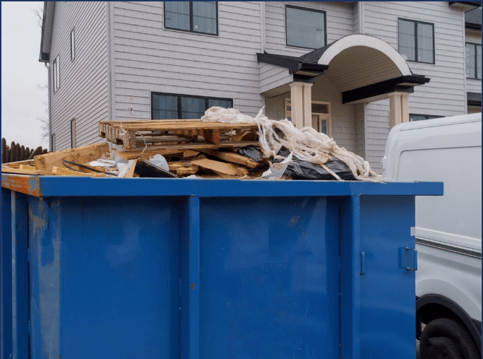 Roll off dumpster in front of renovation house