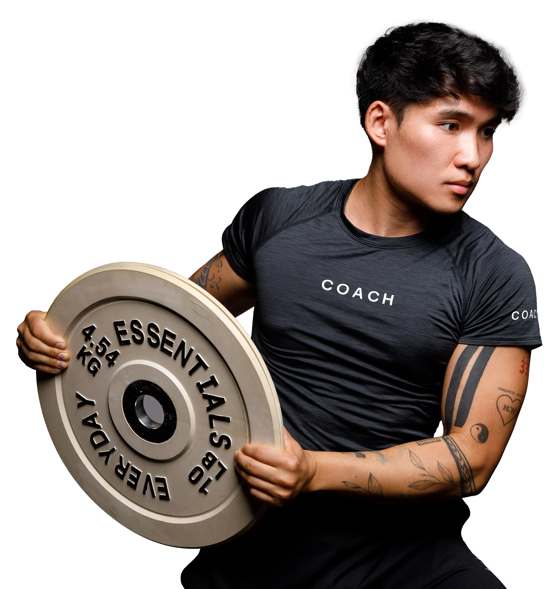 A person in a gray performance shirt holding a 10 lb, 4.5 kg weight plate in front of their chest.