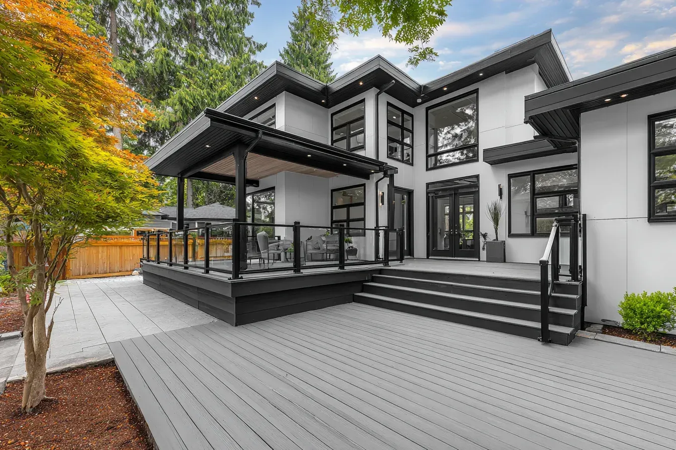 Garden deck Vancouver designed by Deck Builders Vancouver with cedar surfaces, custom trim, and landscaping integration. This deck construction Vancouver BC enhances outdoor aesthetics. Great for backyard retreats.
Modern deck design Vancouver using composite boards, minimalist railings, and contemporary outdoor styling. Deck Builders Vancouver excel in sleek, modern deck installations. Ideal for newer homes.