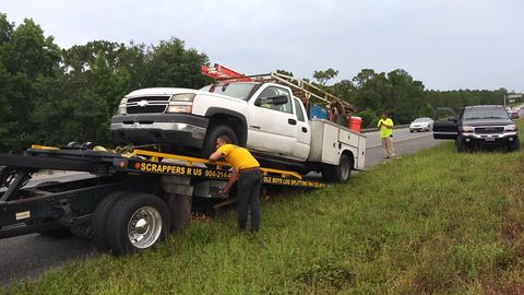 Flatbed Towing — Towing the Car on the Road in Fleming Island, FL