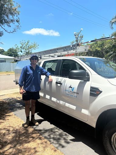 A Plumber is Fixing a Sink Pipe With a Wrench — Vision Plumbing Queensland in Pimlico, QLD