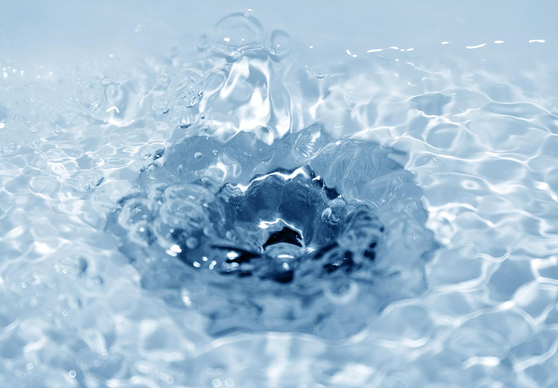 A Drop of Water is Falling Into a Pool of Water — Vision Plumbing Queensland in Pimlico, QLD