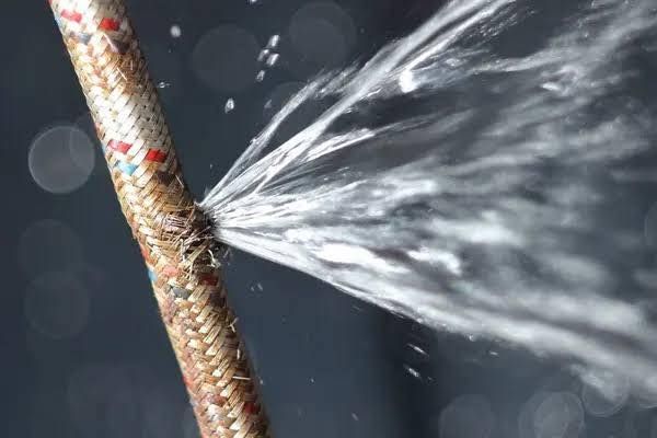 Copper Pipes and Fittings Are Laying on Top of a Blueprint — Vision Plumbing Queensland in Pimlico, QLD