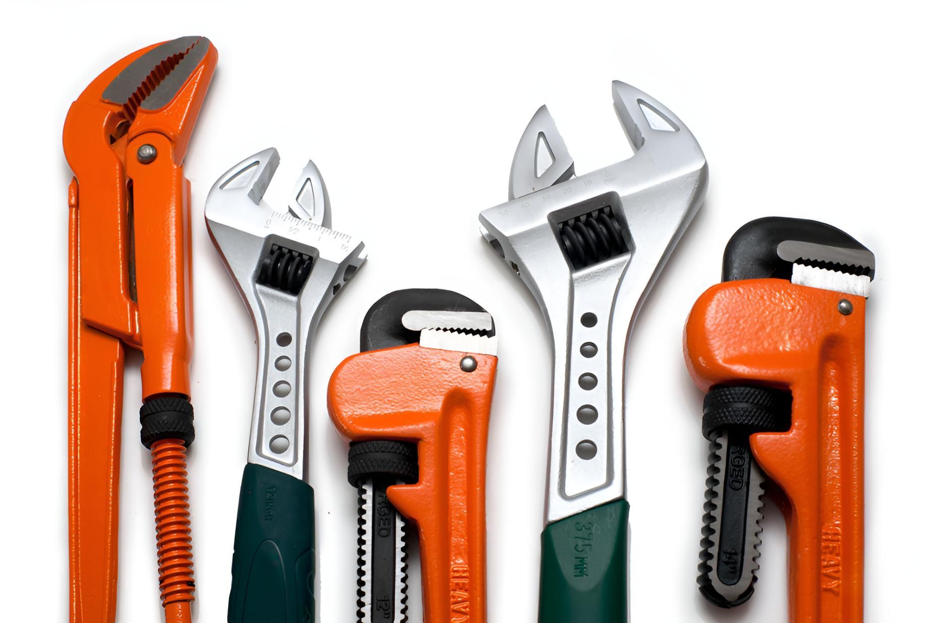 A Group of Pipe Wrenches Are Lined Up in a Row — Vision Plumbing Queensland in Pimlico, QLD