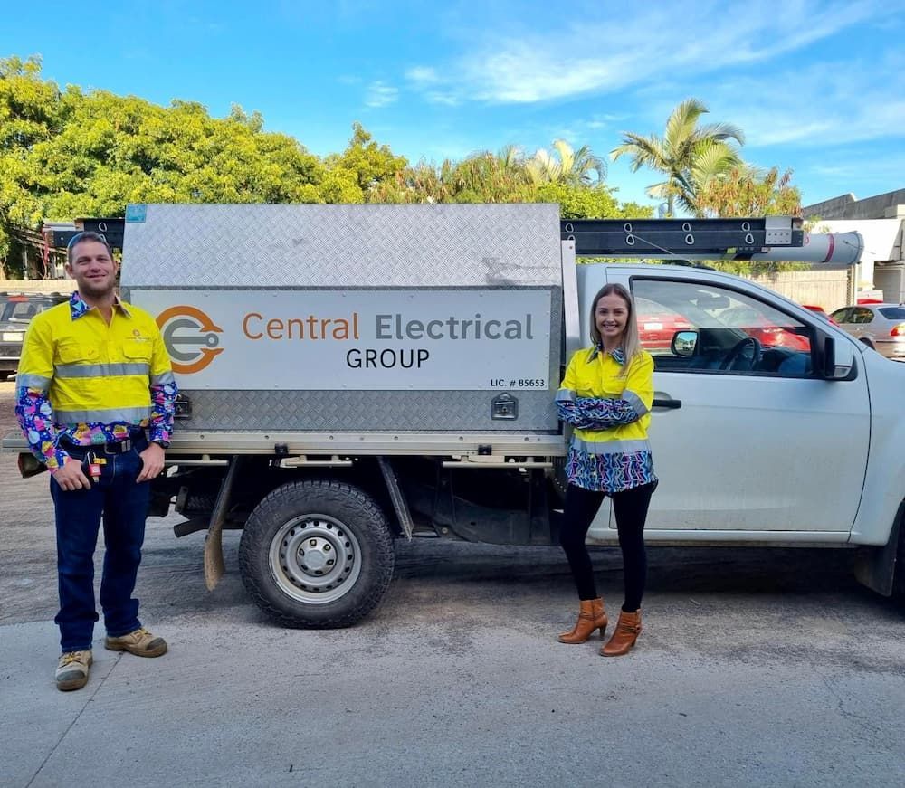Two People Standing in Front of a Truck — Central Electrical Group in Gladstone Central, QLD