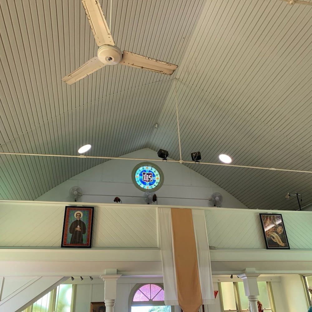 A Ceiling Fan is Hanging From the Ceiling of a Church — Central Electrical Group in Gladstone Central, QLD