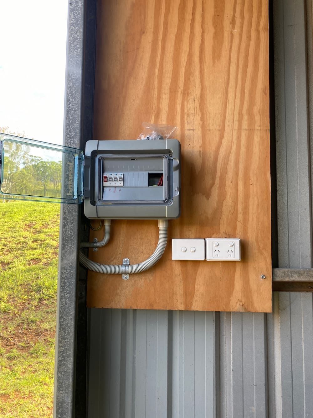 There is a Electrical Box on the Side of a Building — Central Electrical Group in Rockhampton, QLD