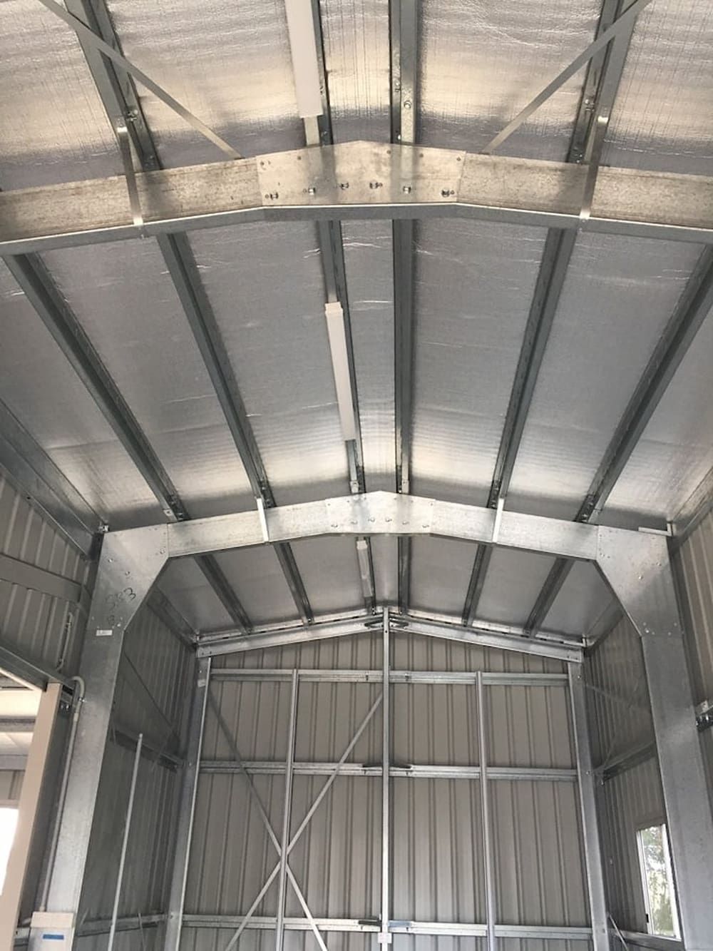 The Inside of a Metal Building With a Metal Roof — Central Electrical Group in Gladstone Central, QLD