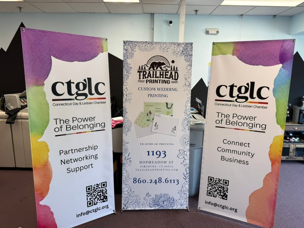 Three vertical banners: two with