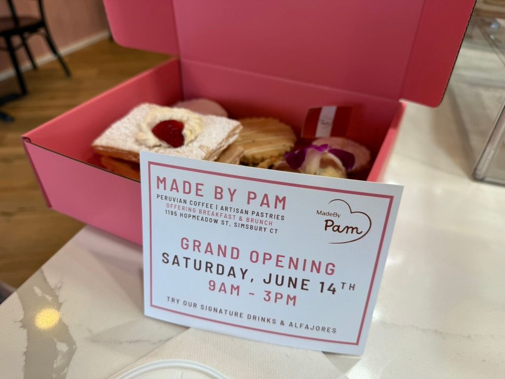 Pink box of pastries with a 