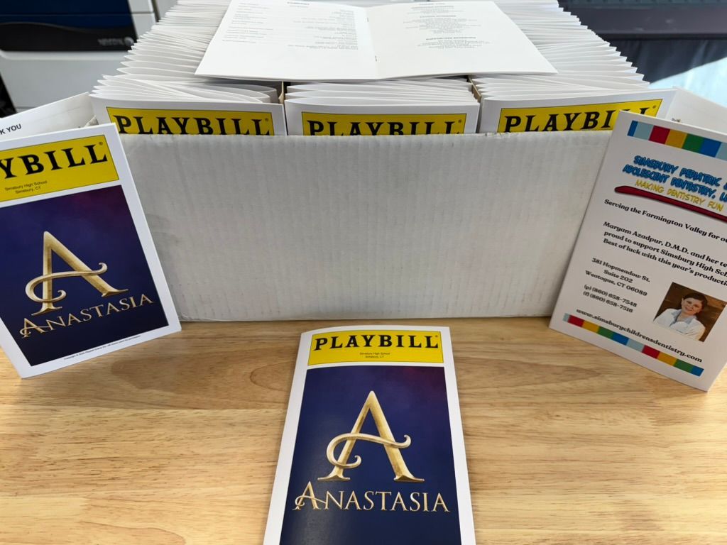 Playbills and boxes of programs for the musical 
