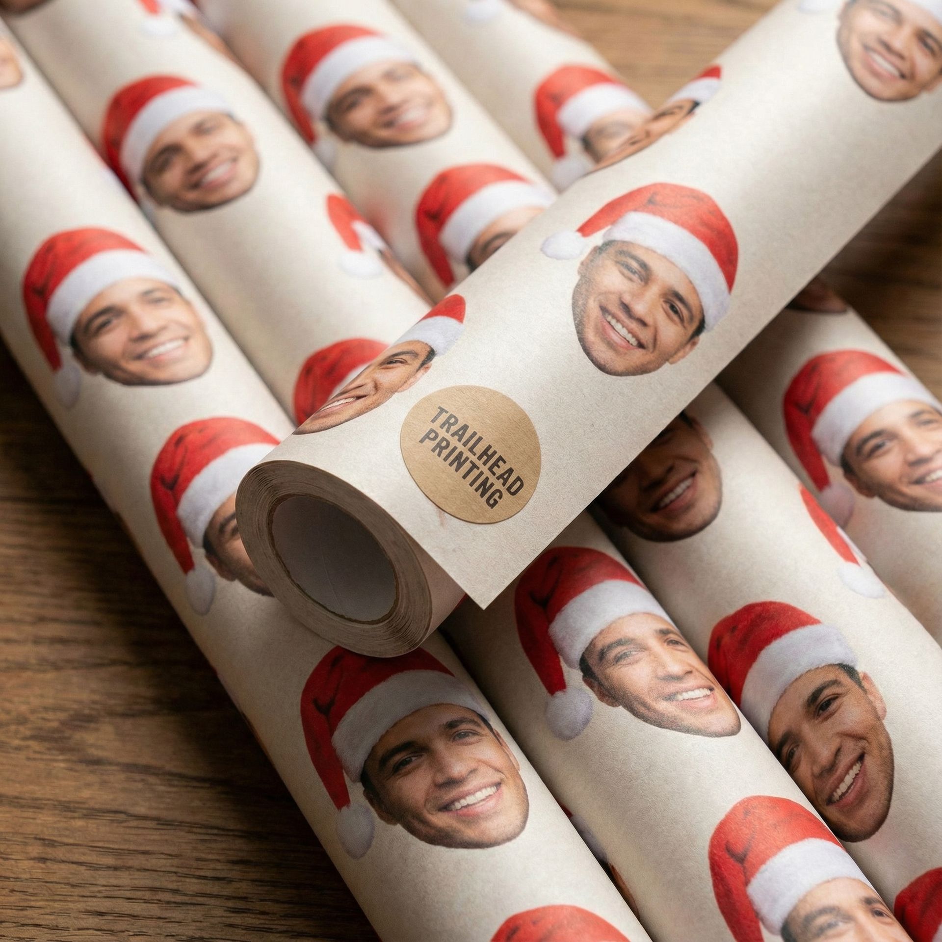 Four landscape calendars in a row, displaying nature scenes, leaning on a stone floor against a white wall.