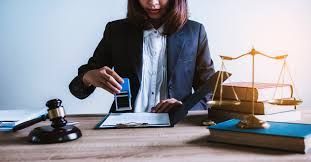 woman stamping paperwork